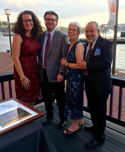 Dana with her husband, mother, and step father by the Baltimore Harbor